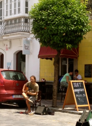 A Flamenco guitar player busking in the old quarter, Tarifa