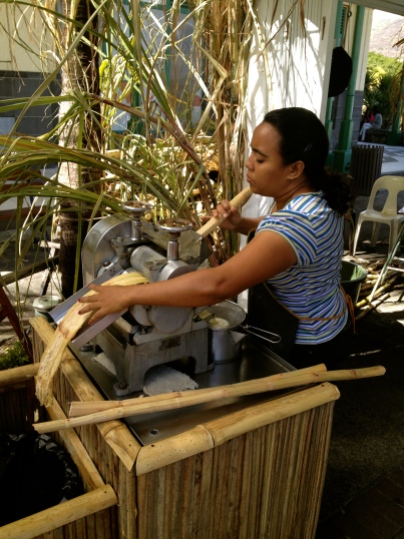 Squeezing fresh sugar cane juice at the marina in Port Louis.