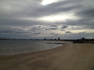 Views from one of the St Kilda beaches back to Port Melbourne and a dramatic winter sky.