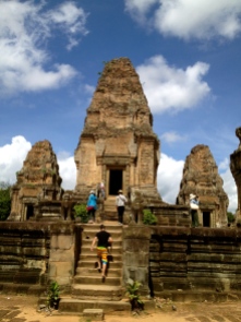 Tourists explore the East Mebon temple ruins.