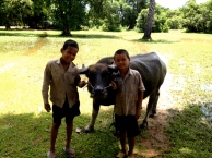 These two boys were herding their water buffalo in the grounds of the Prea Rup temple ruin. We first spotted them from high on the temple, where we could see the water buffalo enjoying a refreshing dip in the deep pools of water created by the wet season.