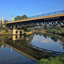 The MacRobertson bridge over the Yarra River, with sky reflected on water